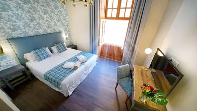 Cama o camas de una habitación en Hotel Emblemático Agáldar