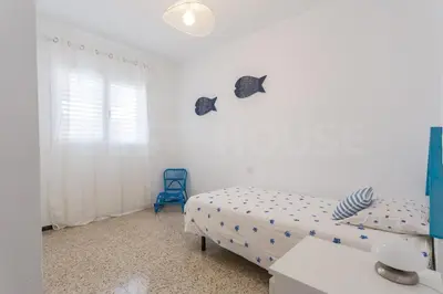 Cama o camas de una habitación en Cozy Apartment in Salinetas Beach.