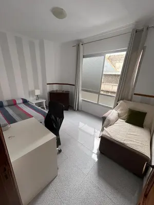 Cama o camas de una habitación en Apartamento céntrico y luminoso ALCARAVANERAS