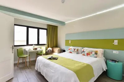 Cama o camas de una habitación en Hotel Apartamento Bajamar