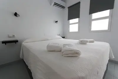 Cama o camas de una habitación en bungalow with terrace near the beach