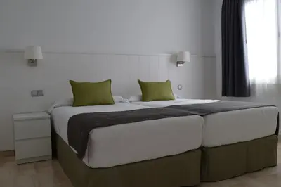 Cama o camas de una habitación en Apartamentos Hotel Parque