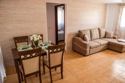 Zona de estar de APARTAMENT SARDINA NEAR THE BEACH WITH POOL AND WIFI e