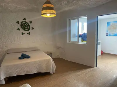 Cama o camas de una habitación en Casas Cuevas Tecen Valsequillo