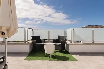 Un balcón o terraza de Big Villa Tauro with Private Heated Saltwater Pool & Jacuzzi & BBQ & Game Room & Arcade Games