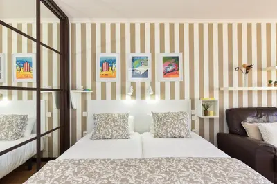 Cama o camas de una habitación en Beachfront Apartment Las Canteras LM52YY by VillaGranCanaria