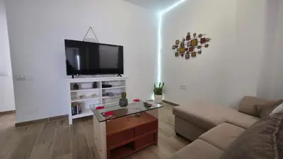 Una televisión o centro de entretenimiento en Apartment with terrace