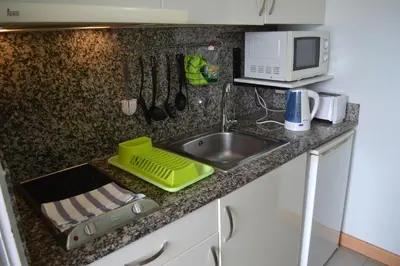 Una cocina o zona de cocina en Green Loft - Vivienda Vacacional a Playa del Inglés