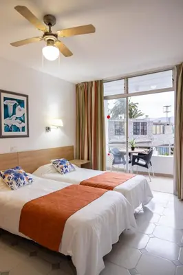 Cama o camas de una habitación en Apartamentos Maspalomas Foresta