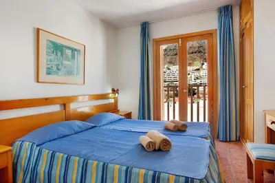 Cama o camas de una habitación en Montecarlo Apartamento10