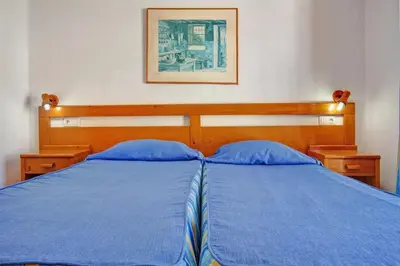 Cama o camas de una habitación en Montecarlo Apartamento10