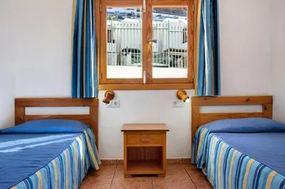 Cama o camas de una habitación en Montecarlo Apartamento10