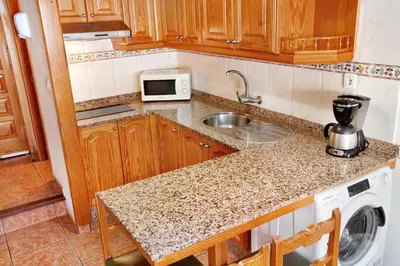 Una cocina o zona de cocina en Montecarlo Apartamento10