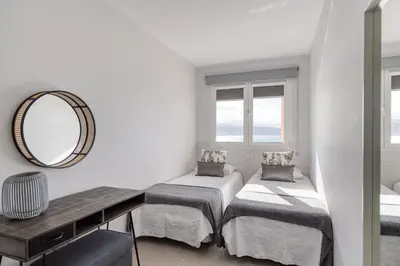 Cama o camas de una habitación en Living Las Canteras Homes - BRIGHT BEACHFRONT