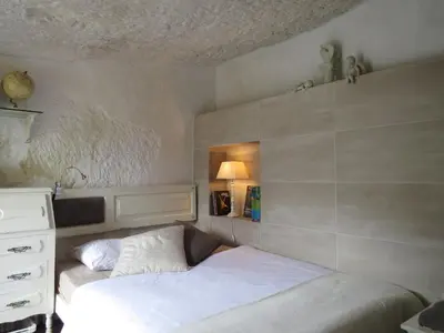 Cama o camas de una habitación en La cueva de Ángel B&B