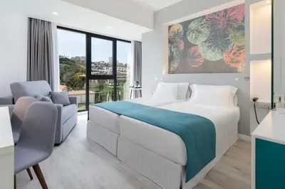 Cama o camas de una habitación en Occidental Las Palmas