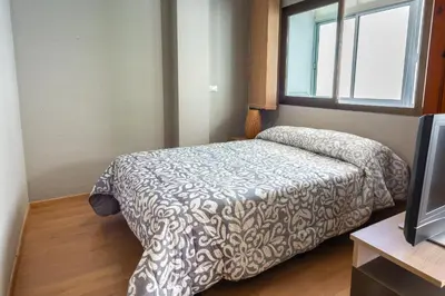 Cama o camas de una habitación en Central Las Canteras Beach