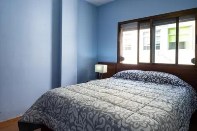 Cama o camas de una habitación en Central Las Canteras Beach