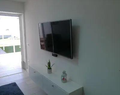 Una televisión o centro de entretenimiento en Cozy Luxury