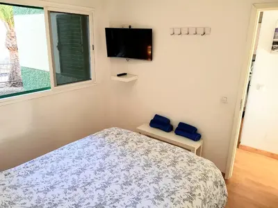 Una televisión o centro de entretenimiento en Apartamento Jumilla Vista Mar 22