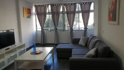 Una televisión o centro de entretenimiento en Apartament 5' CC Yumbo