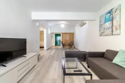 Una televisión o centro de entretenimiento en Bungalow Einstein Xej