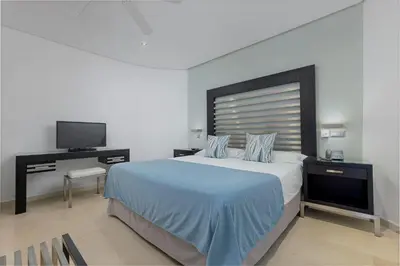Una televisión o centro de entretenimiento en Anfi del Mar Tauro Golf 1 Emerald Club