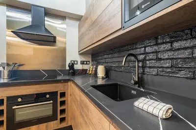 Una cocina o zona de cocina en Apartamentos Marina Suites 6E