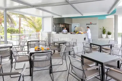 Un restaurante o sitio para comer en Hotel Riu Gran Canaria - All Inclusive