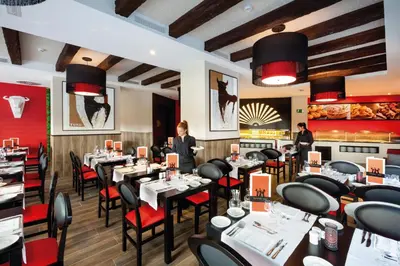 Un restaurante o sitio para comer en Hotel Riu Papayas - All Inclusive