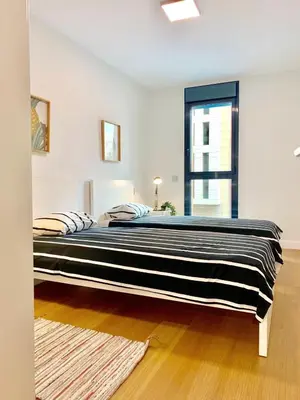 Cama o camas de una habitación en Elegant Beach Flat