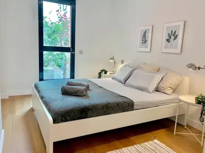 Cama o camas de una habitación en Elegant Beach Flat