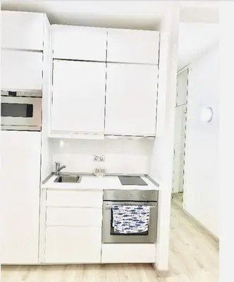 Una cocina o zona de cocina en Cosy loft in front of blue ocean