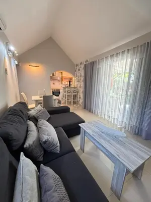 Zona de estar de Flamboyant Tree Garden Holiday Home