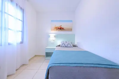 Cama o camas de una habitación en Valle Marina Apartamentos