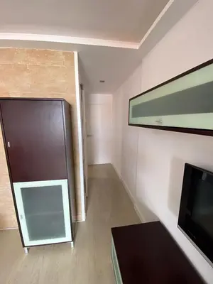 Una televisión o centro de entretenimiento en Golden Apartment