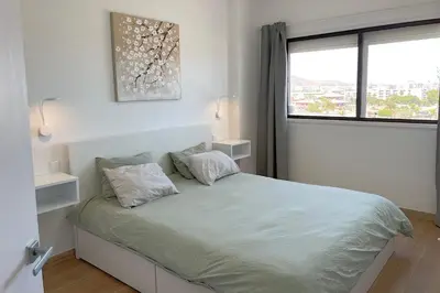 Cama o camas de una habitación en Iguazu TIR24 Top Floor Apartment
