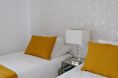 Cama o camas de una habitación en Apartamento frente a la playa de Las Canteras S3