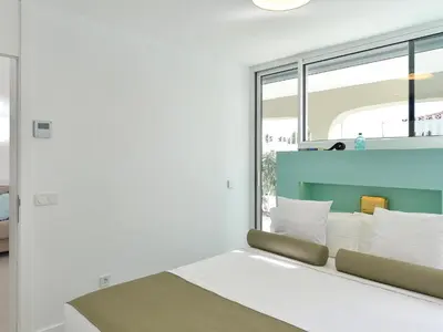 Cama o camas de una habitación en VelSuites Playa del Ingles by VillaGranCanaria