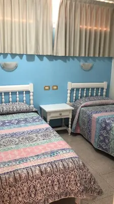Cama o camas de una habitación en APARTAMENTOS FARILAGA Relax y Descanso