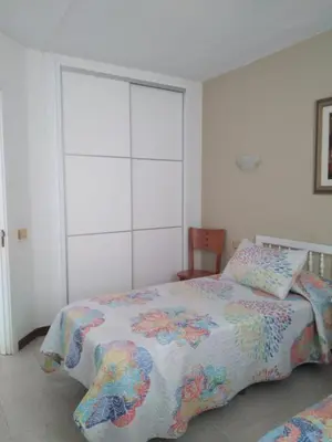 Cama o camas de una habitación en APARTAMENTOS FARILAGA Relax y Descanso