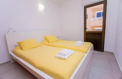 Cama o camas de una habitación en Arinaga Colors, tu casa en la playa