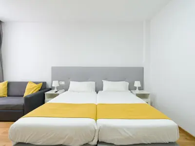 Cama o camas de una habitación en Ok Las Canteras Beach by CanariasGetaway