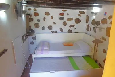 Cama o camas de una habitación en La Alpispa