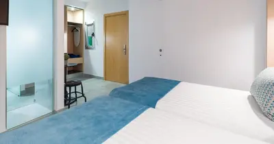 Cama o camas de una habitación en Tusity One