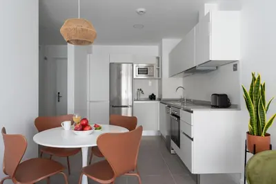 Una cocina o zona de cocina en Royal Flats-Viviendas Vacacionales