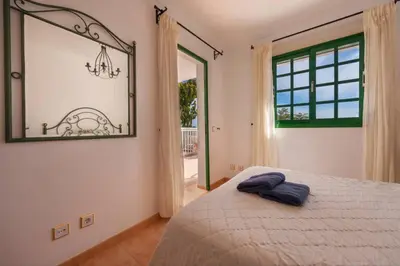 Cama o camas de una habitación en Dúplex con jardín y buenas vistas