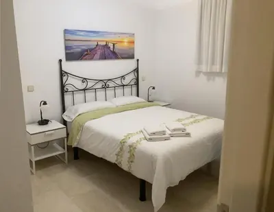 Cama o camas de una habitación en BEACH SIDE