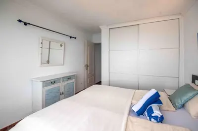 Cama o camas de una habitación en Ferienwohnung am Strand - 2 Schlafzimmer