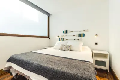 Cama o camas de una habitación en Taliarte Lighthouse Shared Terrace